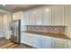 White kitchen cabinets and granite countertops at 1143 Williams Loop, Elizabeth, CO 80107