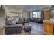 Spacious living room featuring leather furniture and hardwood floors at 1143 Williams Loop, Elizabeth, CO 80107