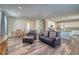 Open living room and kitchen with hardwood floors at 1143 Williams Loop, Elizabeth, CO 80107