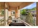 Relaxing balcony with outdoor seating and views of the surrounding neighborhood at 6874 Raspberry Run, Littleton, CO 80125