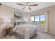 Comfortable bedroom with a view, neutral tones, and soft natural lighting at 6874 Raspberry Run, Littleton, CO 80125
