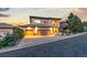 Stunning exterior of the house with a three-car garage and professional landscaping at 6874 Raspberry Run, Littleton, CO 80125