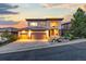 Stunning two-story home with a three-car garage, landscaped yard, and balcony showcasing an amazing sunset at 6874 Raspberry Run, Littleton, CO 80125