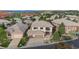 Inviting two-story home with an attached three-car garage and balcony situated within a picturesque neighborhood setting at 6874 Raspberry Run, Littleton, CO 80125