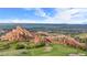 Picturesque golf course featuring impressive red rock formations and views at 6874 Raspberry Run, Littleton, CO 80125