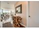 Hallway with a unique wood console table, decorative mirror, and views of the open-concept living area at 4200 W 17Th Ave # 611, Denver, CO 80204