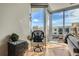 Bright office nook with glass desk, ergonomic chair, and city views from large windows at 4200 W 17Th Ave # 611, Denver, CO 80204