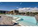 Bright rooftop swimming pool featuring lounge chairs, tables and umbrellas offering relaxation with a view of the neighborhood at 4200 W 17Th Ave # 611, Denver, CO 80204