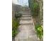 Backyard stone steps leading to a beautiful garden and landscape at 22778 E Alamo Ln, Aurora, CO 80015