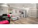 Finished basement featuring wood floors, modern furniture and recessed lighting at 22778 E Alamo Ln, Aurora, CO 80015