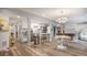 Finished basement area features an open concept layout, kitchenette, and dining area at 22778 E Alamo Ln, Aurora, CO 80015