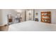 Bright bedroom featuring a white comforter, vanity and a bright lamp at 22778 E Alamo Ln, Aurora, CO 80015
