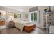 Cozy bedroom with a large window and wood-look flooring at 22778 E Alamo Ln, Aurora, CO 80015