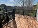 Back deck with black metal railing overlooking the yard and surrounding neighborhood at 22778 E Alamo Ln, Aurora, CO 80015