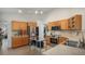 Spacious kitchen featuring wood cabinets, stainless appliances, and neutral paint at 22778 E Alamo Ln, Aurora, CO 80015