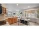 Bright kitchen featuring wood cabinets, stainless appliances, and lots of sunlight at 22778 E Alamo Ln, Aurora, CO 80015