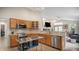 Functional kitchen featuring tile countertops, oak cabinets, and stainless steel appliances at 22778 E Alamo Ln, Aurora, CO 80015