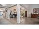 Bright, open-concept living room featuring hardwood floors, neutral paint, and a cat tree at 22778 E Alamo Ln, Aurora, CO 80015