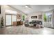 Well-lit living room with neutral paint, carpeted rug, and a sliding door to the outside at 22778 E Alamo Ln, Aurora, CO 80015