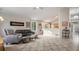 Inviting living room featuring an open layout, hardwood floors, and comfortable seating at 22778 E Alamo Ln, Aurora, CO 80015
