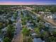 An elevated view of the neighborhood showcasing houses with mature trees lining the streets during the early evening at 2666 S Green Ct, Denver, CO 80219