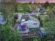 Aerial view of the property showing the backyard deck with furniture, plus solar panels on the roof at 2666 S Green Ct, Denver, CO 80219