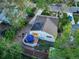 Aerial view of the property showing the backyard deck with furniture and solar panels on the roof at 2666 S Green Ct, Denver, CO 80219