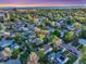 Aerial shot showcasing the neighborhood with lush trees and the property's location in a residential area at 2666 S Green Ct, Denver, CO 80219
