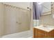 Clean and functional bathroom with a tiled shower, vanity, and well-maintained fixtures, providing a refreshing and practical space at 2666 S Green Ct, Denver, CO 80219