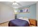 Calm bedroom with a comfortable bed, natural light, and hardwood floors, creating a relaxing and inviting atmosphere at 2666 S Green Ct, Denver, CO 80219