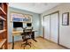 Bright home office with a modern desk setup, hardwood floors, and natural light, creating a productive workspace at 2666 S Green Ct, Denver, CO 80219