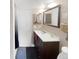 Bathroom featuring a modern vanity with a large mirror, a shower and toilet at 3782 S Genoa Cir # A, Aurora, CO 80013