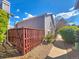 A charming single Gathering home exterior featuring a fenced yard and a gravel area at 3782 S Genoa Cir # A, Aurora, CO 80013