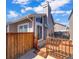 Exterior shot of a home featuring a deck, sliding glass door and fenced yard at 3782 S Genoa Cir # A, Aurora, CO 80013