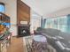 Inviting living room with a wood-burning fireplace, vaulted ceilings, and lots of natural light at 3782 S Genoa Cir # A, Aurora, CO 80013