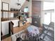 Living room featuring a fireplace, vaulted ceilings, and lots of natural light coming from large windows at 3782 S Genoa Cir # A, Aurora, CO 80013