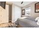 Relaxing bedroom featuring a queen bed, closet, and a sunlit window providing an inviting atmosphere at 10555 Boston St, Commerce City, CO 80640
