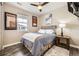 Cozy bedroom with stylish décor, a ceiling fan, and natural light at 10555 Boston St, Commerce City, CO 80640