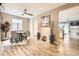 Cozy dining room with a modern table, ceiling fan, and hardwood floors at 10555 Boston St, Commerce City, CO 80640