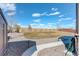 Backyard with stone walkway to patio featuring lush green lawn and mature trees at 1265 Black Haw St, Elizabeth, CO 80107