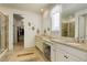 Bright bathroom featuring double sinks, granite countertops, and a separate shower and walk-in closet at 1265 Black Haw St, Elizabeth, CO 80107