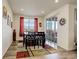 Bright dining room featuring hardwood floors, recessed lighting, and sliding door access to the outdoor deck at 1265 Black Haw St, Elizabeth, CO 80107