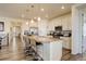 Modern kitchen island with barstool seating and updated appliances enhance this bright and functional cooking space at 1265 Black Haw St, Elizabeth, CO 80107