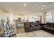 Open-concept living room featuring a kitchen with granite countertops, stainless steel appliances, and a breakfast bar at 1265 Black Haw St, Elizabeth, CO 80107