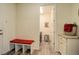 Convenient mud room featuring a bench, cabinet, and access to the laundry area at 1265 Black Haw St, Elizabeth, CO 80107