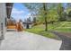 The backyard features a shed, concrete patio, deck and ample green space at 11172 W Exposition Dr, Denver, CO 80226