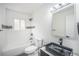 Modern bathroom featuring subway tile, glass enclosed shower, and new vanity at 11172 W Exposition Dr, Denver, CO 80226