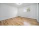 Bright bedroom featuring hardwood floors, a window, and neutral wall paint at 11172 W Exposition Dr, Denver, CO 80226