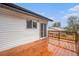 Lovely rear wooden deck accessible from the house featuring white siding at 11172 W Exposition Dr, Denver, CO 80226