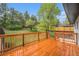 Spacious rear wooden deck overlooks the backyard and landscaping at 11172 W Exposition Dr, Denver, CO 80226